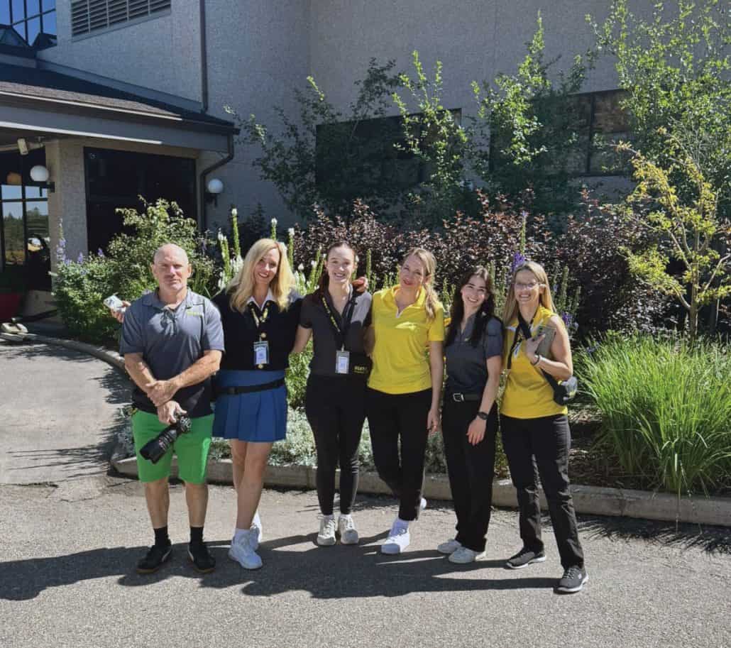 Raising money and awareness for cancer care. 1 Six people part of a golf team standing together.