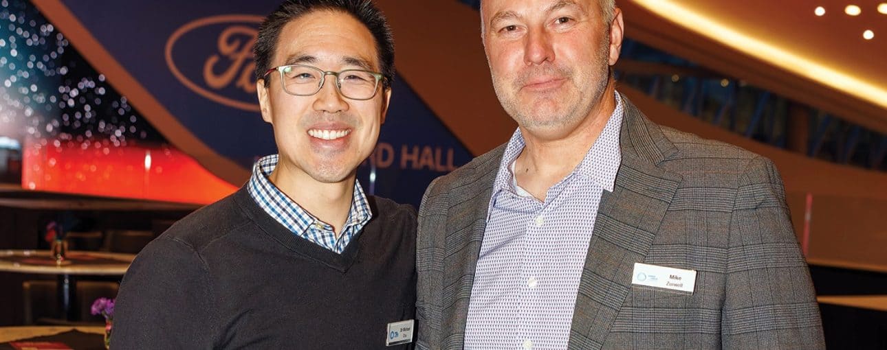 Dr. Michael Chu and Mike Zurwell smiling at the camera.