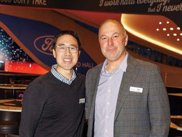 Dr. Michael Chu and Mike Zurwell smiling at the camera.