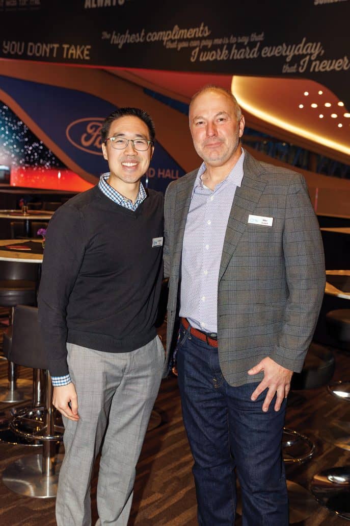 Dr. Michael Chu and Mike Zurwell smiling at the camera.