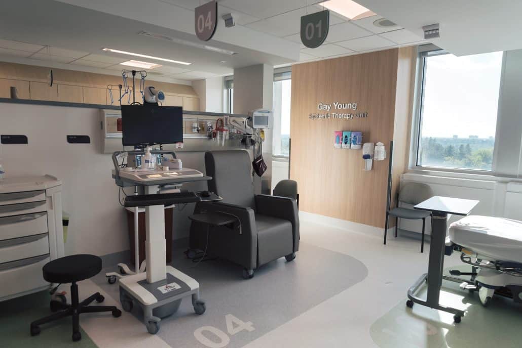 Cancer centre unit with a chairs, monitoring screen and supplies.  