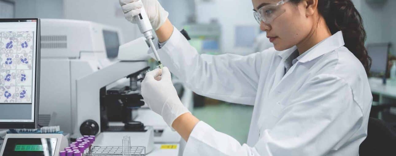 Lab tech working with equipment.