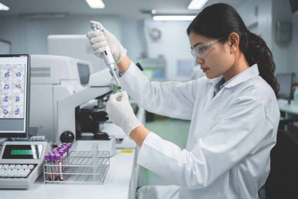 Lab tech working with equipment.