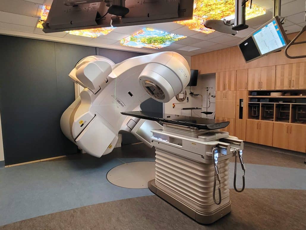 A legacy donation supports community care. 1 A linear accelerator in a hospital room.