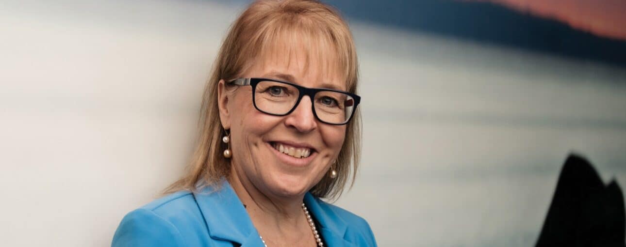 Dr. Linda Watson in a blue blazer.