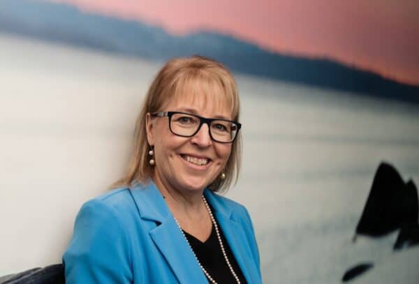 Dr. Linda Watson in a blue blazer.
