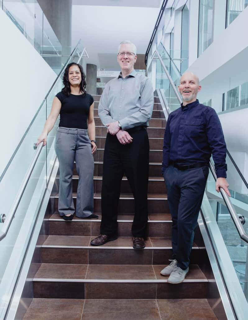 The Palliative Oncology Pharmacy team stand in the stairs. 