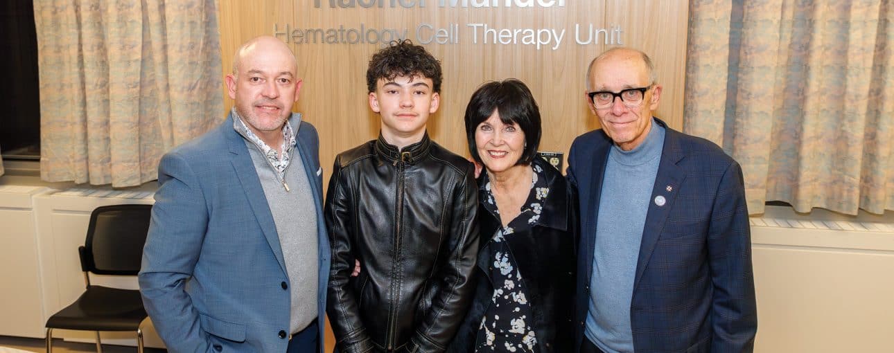 Rachel Mandel's family standing in front of hematology unit named in her memory.