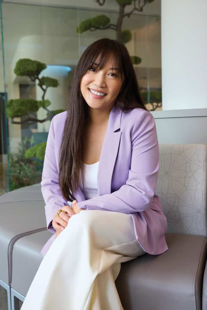The power of planning ahead 1 Woman with dark bangs and a purple blazer sits with her legs crossed.